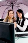 Executives Holding Umbrella Stock Photo