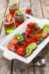 Red And Green Jelly Served With Fruit Stock Photo