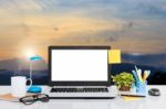 Laptop Computer On Desk And Landscape View Background Stock Photo