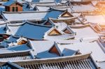 Roof Of Jeonju Traditional Korean Village Covered With Snow, Jeonju Hanok Village In Winter, South Korea Stock Photo