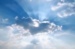 Sunbeam  Through The Haze On Blue Sky Stock Photo