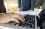 Closeup Of Businessman Is Keyboarding On Portable Net-book, Whil Stock Photo