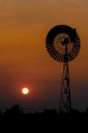 Wind Turbine In Sunset Stock Photo