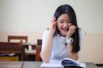 Portrait Of Thai Teen Beautiful Girl Writing Book Stock Photo