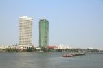 Construction And Completed Building On The River Bank Stock Photo