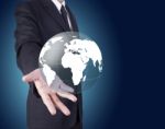 Businessman Holding Globe Stock Photo