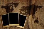 Old Photo Frame On World Map. Stock Photo