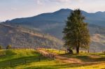 September Rural Scene In Mountains. Authentic Village And Fence Stock Photo