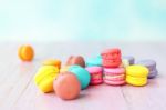 Colorful Macarons On A Pink Wooden Table Stock Photo