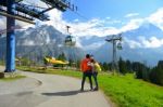 Young Couple Of Travelers Enjoying A Mountains View In The Summe Stock Photo