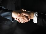 Handshaking Business People Stock Photo