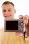 Handsome Man Showing Digital Camera Stock Photo