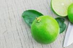 Lime And Knife On Wooden Stock Photo