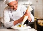 Professional Chef Decorating The Dish Stock Photo