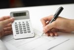 Bookkeeping With Calculator Stock Photo