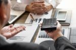 Business Man Working At Office With Laptop, Tablet And Graph Dat Stock Photo