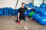 Happy Man Doing Stretching Exercises In A Health Club Stock Photo