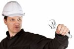 Handyman Wearing Uniform And Hardhat Stock Photo