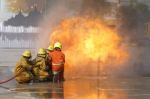 Fireman. Firefighters Fighting Fire During Training Stock Photo