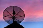 Satellite Dish In Evening Sky Stock Photo