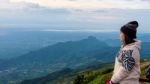 Woman Tourist Watching The Sunrise Stock Photo