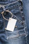 White Card On Blue Jeans Stock Photo