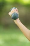 Beautiful Woman Holding Weights Stock Photo