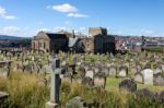 Whitby, North Yorkshire/uk - August 22 : Whitby Church And Graveyard In North Yorkshire On August 22, 2010. Unidentified People Stock Photo