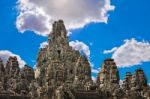 Ancient Stone Faces Of King Jayavarman Vii At The Bayon Temple, Stock Photo