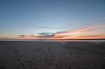 Sunrise Horizon Line On A Deserted Beach Stock Photo