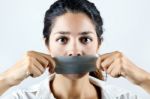 Woman With Mouth Covered With Tape. Concept Of Forbidden Opinion Stock Photo