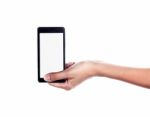 Mobile Phone In Female Hand Isolated On A White Background, To C Stock Photo