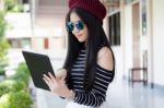 Portrait Of Thai Teen Beautiful Girl Using Her Tablet Stock Photo