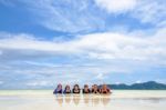 Happy Family Lying Together On The Beach, Thailand Stock Photo