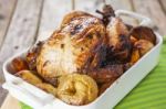 Roasted Chicken With Apples And Potatoes Stock Photo