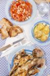 Grilled European Seabass With Potato And Tomato Salad Stock Photo