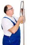 Worker Cutting Screw On A Metal Tube Stock Photo