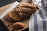 Dark Multigrain Bread Whole Grain Fresh Baked On Rustic Closeup Stock Photo