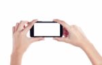 Mobile Phone In Female Hand Isolated On A White Background, To C Stock Photo