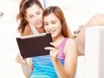 Happy Teenage Girls Using Touchpad Stock Photo