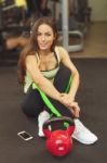 Happy Woman Having A Break From Exercising In Health Club Stock Photo