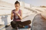 Woman Relaxing After Sports And Drinking Water Stock Photo