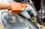 Car Mechanic In His Repair Shop Standing Next To The Car - Close Stock Photo