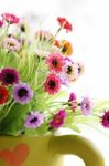 Colorful Is Flowers In A Green Vase Stock Photo