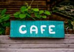 Old Cafe Sign On Wooden Stock Photo