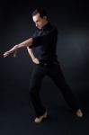 Young Flamenco Dancer In Beautiful Dress On Black Background Stock Photo