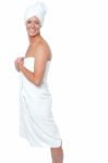 Gorgeous Female In Bath Towel Posing Sideways Stock Photo