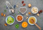 Ingredients For A Healthy Foods Background, Nuts, Honey, Berries Stock Photo