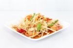 Thai Food Papaya Salad On White Dish Stock Photo