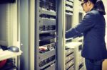 Man Fix Server Network In Data Center Room Stock Photo